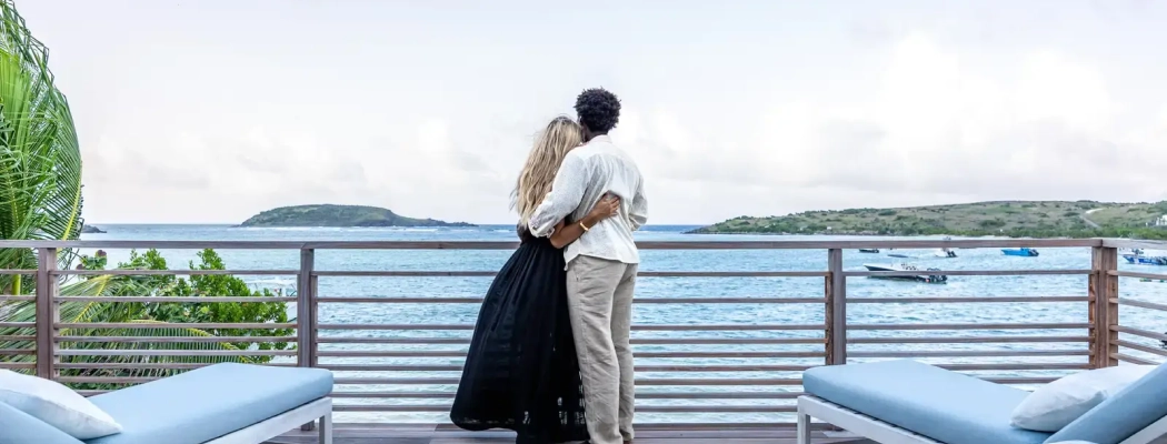 Couple watching the ocean from the deck